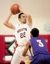 Houston's Scott Kramer looks for an open teammate during the Hawks' game against the Lathrop Malemutes last Saturday at Houston High School. Robert DeBerry