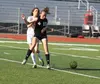 Wasilla's Addie Mesick collides with Colony's Gabby Wakaliuk during a 0-0 tie May 13, 2016, at Wasilla High School. JEREMIAH BARTZ/Frontiersman