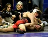 Wasilla's Thailyn Reynolds tries to pin Palmer's Cason Mastberg during the 140-pound final of the Northern Lights Conference Championships Saturday at Palmer High. Jeremiah Bartz/Frontiersman