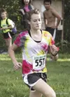 Mariah Burroughs makes the final sprint to the finish line
during the Colony Twilight on Tuesday at Colony High School.
Burroughs finished second in the race. JEREMIAH
BARTZ/Frontiersman