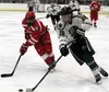Wasilla freshman Dylan Abbott tries to prevent Colony sophomore Jake Hessinger from driving to the net during Wasilla's win over the Knights earlier this month in Wasilla. Courtesy of Bruce E