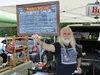 Steve Tracy, the 'Angry Hippy' displays his home-made salsa options at Peters Creek Farmers’ Market and Crafts at American Legion Post 33 in Chugiak. MELINDA MUNSON/For The Eagle