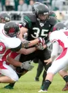 ROBERT DeBERRY/Frontiersman Colony senior Dakota Wainwright runs
for a gain against Juneau. The Knights are now ranked third.