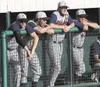 JEREMIAH BARTZ/Frontiersman Members of the Alaska Road Warriors
stand at the edge of the dugout during the Alaska American Legion
State Championships. The Road Warriors are still alive in tou