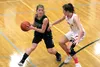 Colony senior Alex Carlton tries to move the ball past Wasilla's Maclaren Obremski during the Nothern Lights Conference girls title game earlier this month. Both teams open state tournament p