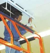 Scott Hubner of Alcan Electric installs cable and speaker
hangers for the demonstration displays in the home electronics
department of the new Wasilla Sears store. Photo by SCOTT
CHRISTIANSEN