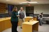 Mat-Su Regional Medical Center Director of Behavioral Health Services Hope Allison and CEO Dave Wallace speak as Mat-Su Opioid Task Force founder Michael Carson (right) listens with the rest 
