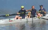 The Kenai Crewsers 4-man team waves to supporters on the shoreline before a race Saturday at the annual Moose Nuggett Regatta on Wasilla Lake Saturday afternoon. At front is Harold Faust. MAT