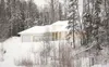 One of several homes the borough has already purchased along the
Bogard Road extension route sits boarded up in this 2009 file
photo. Tuesday, the Mat-Su Borough Assembly voted to exercise
em