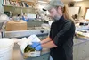 Todd Steinlage, plant pathologist at the Plant Material Center, inspects a carrot crop with an invasive plant. Tim Bradner/For the Frontiersman