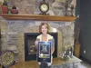 Valley Realtor Kristan Cole with an award showing The Kristan Cole Team as one of the nation's best.