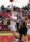 Houston senior Aspen Ruth releases a shot underneath the basket during a win over Homer Friday night. Ruth led the Hawks with 23 points in the final home game of her career. Courtesy of Bruce