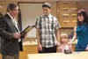 Wasilla Mayor Verne Rupright reads a proclamation during
Monday's city council meeting recognizing the actions of Anthony
Keller, center, and his efforts to save the life of Taylia Hardy,
5. 