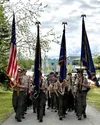 Boy Scouts from Troop 300 lead the procession from the Veterans' Wall in Wasilla to Wasilla Aurora Cemetery for a graveside tribute on Memorial Day. Katie Stavick/Frontiersman