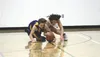 Redington junior Brian Amirault battles a Susitna Valley player for a loose basketball during a win over the Rams Tuesday at Redington Jr./Sr. High School. The victory marked the first varsit