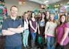 Andrew Gumley, co-owner of Special Events Alaska party store, stands with his staff inside their new location in Wasilla. ROBERT DeBERRY/Frontiersman.com