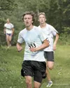 JEREMIAH BARTZ/Frontiersman Palmer’s Mason Minturn runs ahead of
teammate Chris Osiensky during the Colony Twilight Tuesday. Minturn
and Osiensky finished second and third in the race.