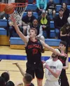 Wasilla's Andrew Devine lays in a bucket Friday night against Soldotna in the Northern Lights Conference semifinals at Soldotna High School. Photo by Joey Klecka/Peninsula Clarion