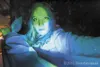 Heather Hanes playing the part of Sarena the mermaid is lit up
with blue and green lights for effect at the Pirates of Dollar Lake
adventue at the Big Lake Lions Recreation and Community Cent