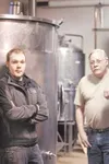ROBERT DeBERRY/Frontiersman Randall Martin and his son Robby
stand inside their Last Frontier Brewing Co. facility in
Wasilla.
