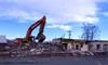 The Jake Wright Fire Hall in Wasilla was demolished Monday afternoon. The site will be a parking lot in the future. Tim Rockey/Frontiersman