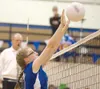 ROBERT DeBERRY/Frontiersman Palmer’s Jessica Dennis reaches for
a block during a 3-1 loss to the Chugiak Mustangs on Thursday at
Palmer High School.