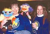 Ingrid Shaginoff, left, and Carol McNamara enjoy the funny-faced
puppets at the Anchorage Association for the Education of Young
Children. The trip was sponsored for families in the Sutton ar