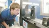 ROBERT DeBERRY/Frontiersman Mat-Su Career and Technical High
School Freshman Kevin Aronowitz uses a structual stress analyzer to
find the breaking point of a threaded metal rod during class M