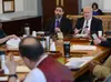 Akis Gialopsos (left), deputy executive director of the Alaska Housing Finance Corp., and Bryan Butcher (right), the corporation's CEO/executive director, testify in front of the Senate Finan