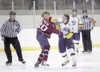 Alaska forward Seth Johnson mixes it up at center ice with
Fairbanks captain Jared Larson during Friday'€™s game at the Curtis
C. Menard II Memorial Ice Arena. The Avs won a 4-2 decision. ROB