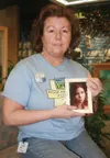 MICHAEL ROVITO/Frontiersman Sherry Moreno holds the picture of
her daughter, Sharday Badillo, who will be recognized during the
Rose Bowl Parade for donating her tissue after dying in a car
a