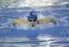 Noelle Graham powers her way to a first-place finish in the girls’ 100-yard butterfly at the Valley Invitational Saturday afternoon at Palmer High School. ROBERT DeBERRY/Frontiersman.com