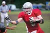 ROBERT DeBERRY/Frontiersman ABOVE: Wasilla sophomore Corey Mock
gets past a Houston Hawk during the Warriors’ 42-7 nonconference
win over the Hawks at Veterans Memorial Field on Friday. Mock
