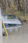 A car sits submerged in about three feet of water in the Butte. Borough officials warn because groundwater can pick up petroleum from roads and driveways, travel through leach fields and thro