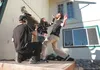 Ella Davis hits zombie actor Zack Pfeiffer as director Trevor Farnsworth films a scene during the shooting of ‘Dead North’ Saturday afternoon at a home on Lazy Mountain. Farnsworth hopes to p
