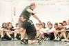 ROBERT DeBERRY/Frontiersman Wrestling coaches Fred McKinney,
left, and David Booth show the Colony Knight wrestling squad proper
technique during practice Monday afternoon.