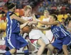 Palmer’s Kasara Brandenburg and Anna Koehn try to strip the ball from Wasilla’s Savanna Burke during the final seconds of Thursday’s quarterfinal game at the ASAA/First National Bank 4A State