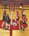Wasilla's Alayna Morgan (top right) sets the ball for a return
against Colony in Tuesday's match in Wasilla. TIM
BRODT/Frontiersman
