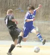 JEREMIAH BARTZ/Frontiersman Palmer sophomore Donovan Hard leaps
past a Nikiski forward to get possession of the ball during
Palmer’s 5-1 win over the Bulldogs on Friday. Hard is one of
severa