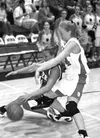 Palmer's Brittany Heck and Hillarie Putnam go after a loose ball
in the third quarter of Friday night's contest at Wasilla. Heck
drained nine points in the game for the Moose. GENE
JANSEN/Fro