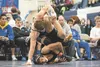 Colony’s Sawyer Root, bottom, and Glennallen/Nome wrestler Lincoln Johnson grapple in the 195-pound division during the team duals at the Lancer Smith Memorial Wrestling Tournament Thursday e