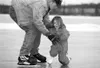 Four-year-old Caitlynn gets some help from her dad, Chad
Chilstrom, Thursday afternoon at the Wasilla ice park. Photo by
WILLIAM WOODY/Frontiersman.