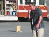 A volunteer wearing makeup simulating exposure to dangerous chemicals from a crashed truck, makes his way to decontamination tents Saturday in the parking lot of the fire station closest to M