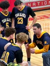 Team Alaska boys basketball coach Matt Peterson discusses strategy during a timeout at Friday’s bronze medal contest at the Arctic Winter Games. The host team edged Nunavut 80-74 in a back-an