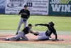 Colony shortstop Trace Severson reaches to tag Chugiak's Sam Hall during a 9-8 win over the Mustangs during the ASAA state quarterfinals Thursday night at Mulcahy Stadium in Anchorage. JEREMI