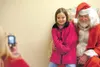 Katie Neyman,6, gets her picture taken with Santa Claus. (ROBERT
DeBERRY/Frontiersman) Robert DeBerry