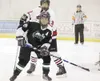 ROBERT DeBERRY/Frontiersman Colony'€™s Trevor Nickerson and
Houston'€™s Cody Lipse watch for the puck in front of Houston'€™s
goal during Friday'€™s game at the Curtis C. Menard II Memorial I