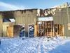 The charred remains of the building that once contained, among other tenants, the Hope for Heroes charity, stand against a blue sky after a fire in Feburary. The charity, which said at the ti