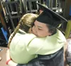 ROBERT DeBERRY/Frontiersman Megan Peratrovich gets a hug from
her mother, Linda, Friday evening at Colony Middle School after her
graduation ceremony. Linda said she was overcome with joy. “I