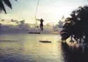 Chuck Heath swings from a rope, getting ready to fall into the
water in the Palmyra Atoll. Submitted photo.